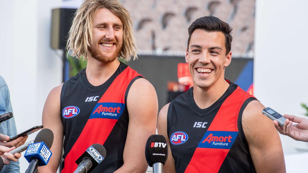 Essendon captain Dyson Heppell unveils the Bombers’ new recruit Dylan Shiel. Picture: Jason Edwards