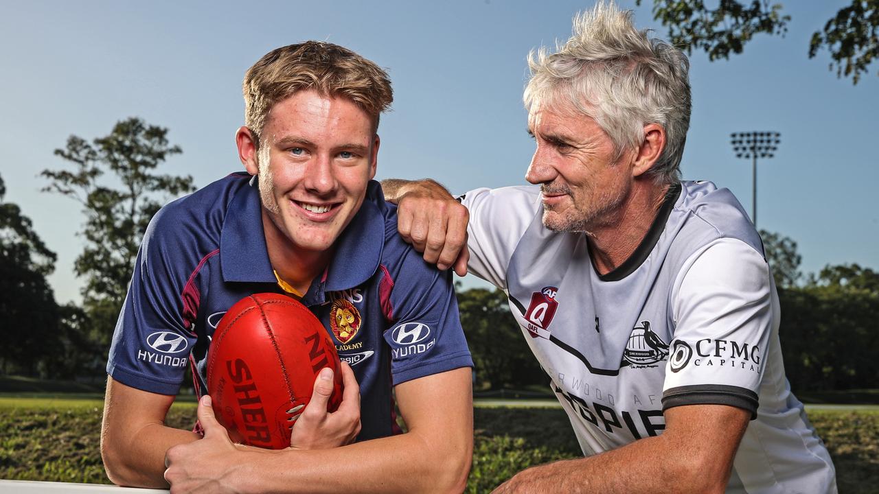 Former Lions player Adrian Fletcher alongside son Jaspa. Picture: Zak Simmonds