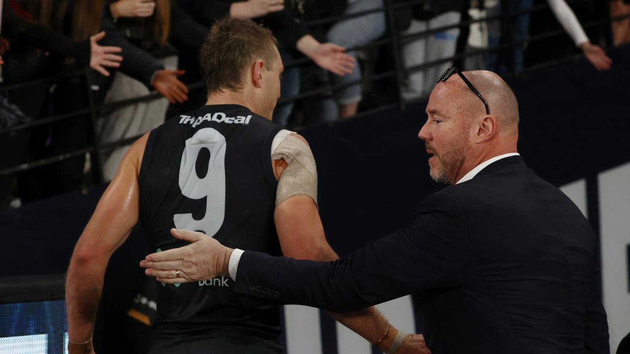 Sayers pats Patrick Cripps on the back as he walks off after the loss. Picture: Michael Klein