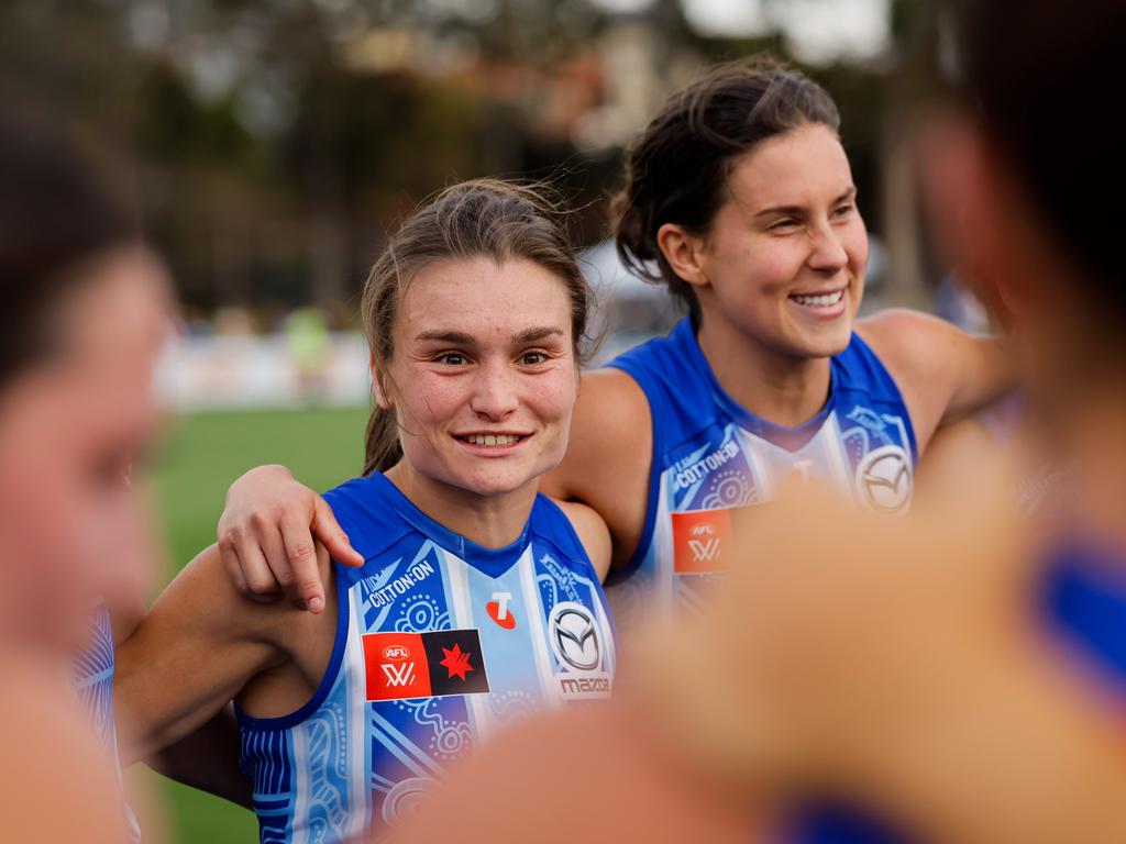 Ash Riddell sings the team song after downing the Suns. Picture: Dylan Burns/AFL Photos via Getty Images.