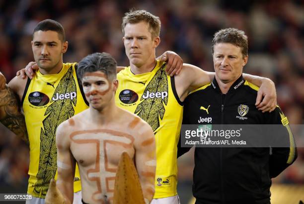 l-r-shaun-grigg-jack-riewoldt-and-damien-hardwick-of-the-tigers-look-on-during-the-war-cry.jpg