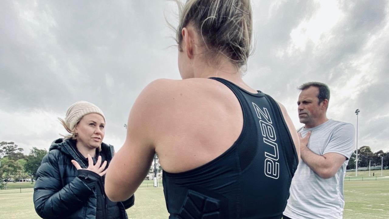 Brad and Donna Johnson with a sportswoman wearing their protective vest. Picture: Supplied