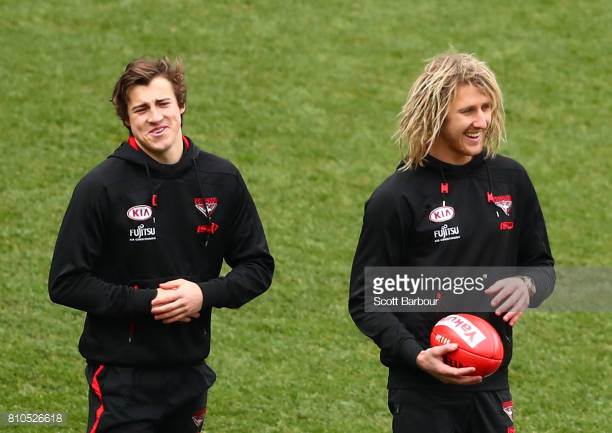 andrew-mcgrath-of-the-bombers-and-dyson-heppell-of-the-bombers-talk-picture-id810526618