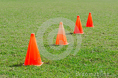 orange-cone-markers-green-grass-playground-41229528.jpg