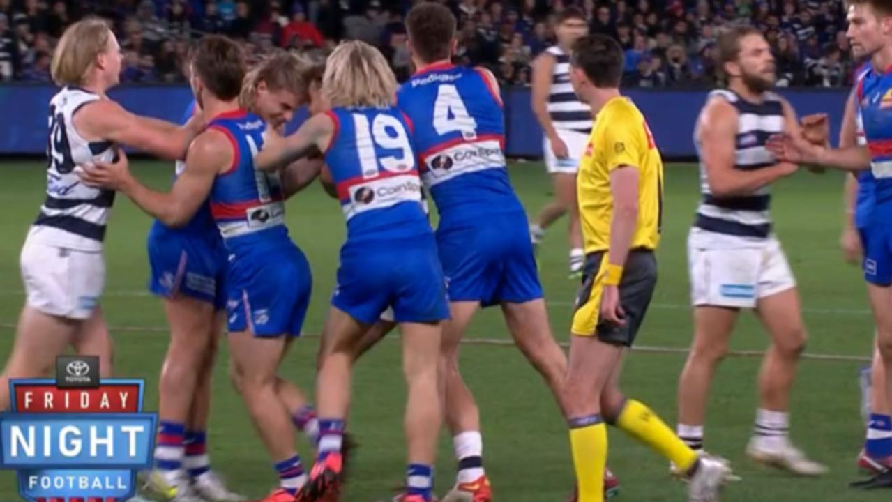 Bulldogs star [PLAYERCARD]Bailey Smith[/PLAYERCARD] makes contact with [PLAYERCARD]Zach Tuohy[/PLAYERCARD]’s face. Picture: Fox Footy