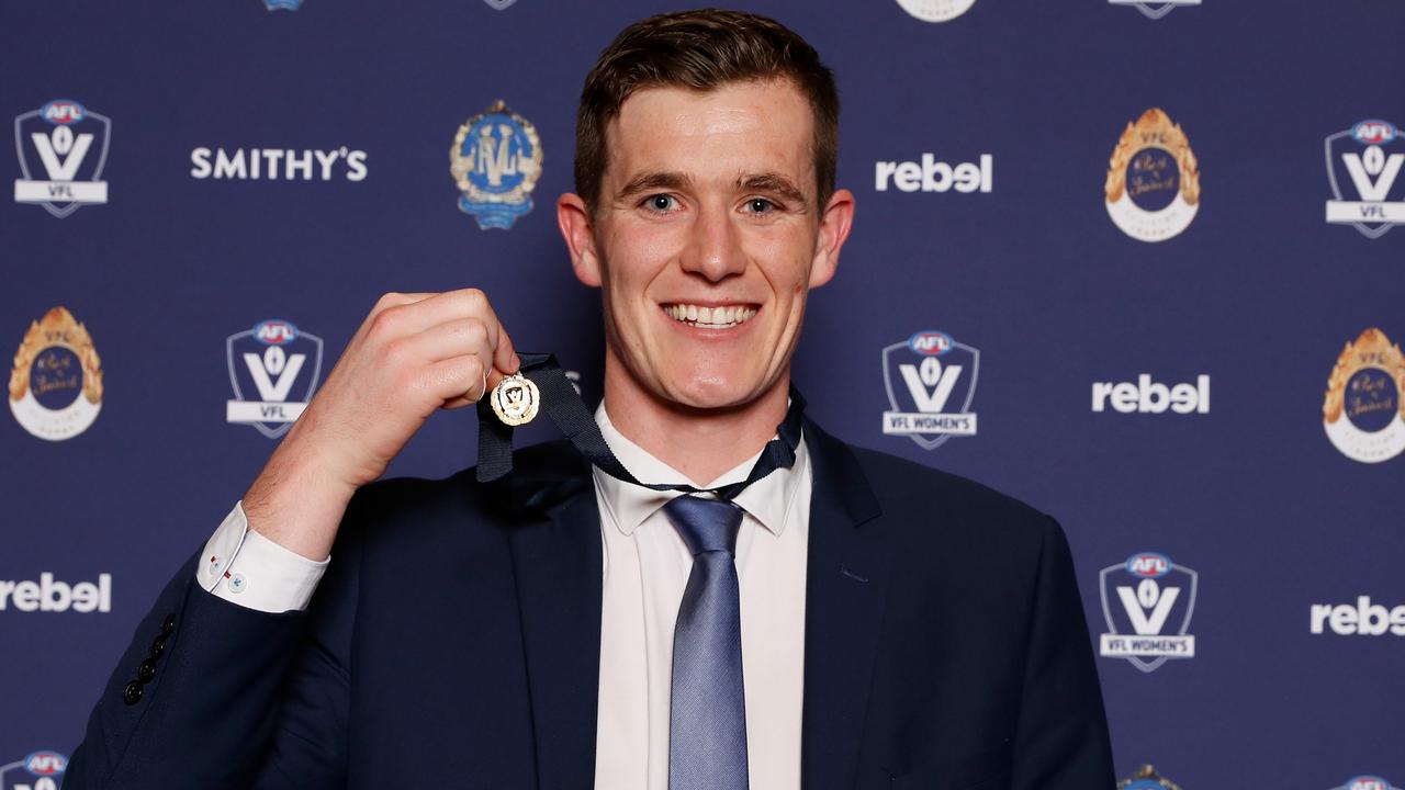 Ethan Phillips with the 2022 Fothergill-Round-Mitchell Medal. Picture: AFL Photos/Getty Images